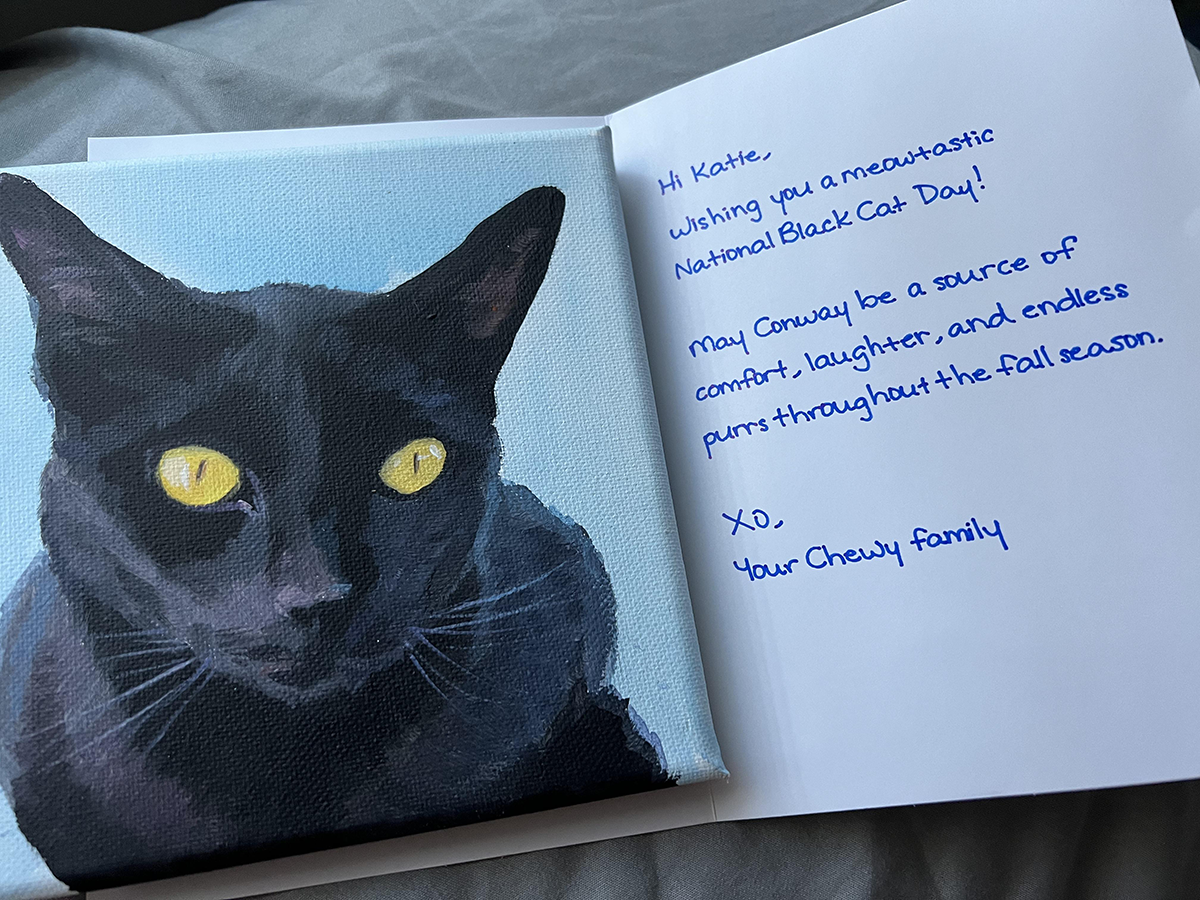 Chewy's thank you for your order handwritten message and an oil cat painting